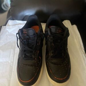 Nike Black Sneakers with Orange Detail